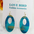 Load image into Gallery viewer, Blue Oval Resin Earrings
